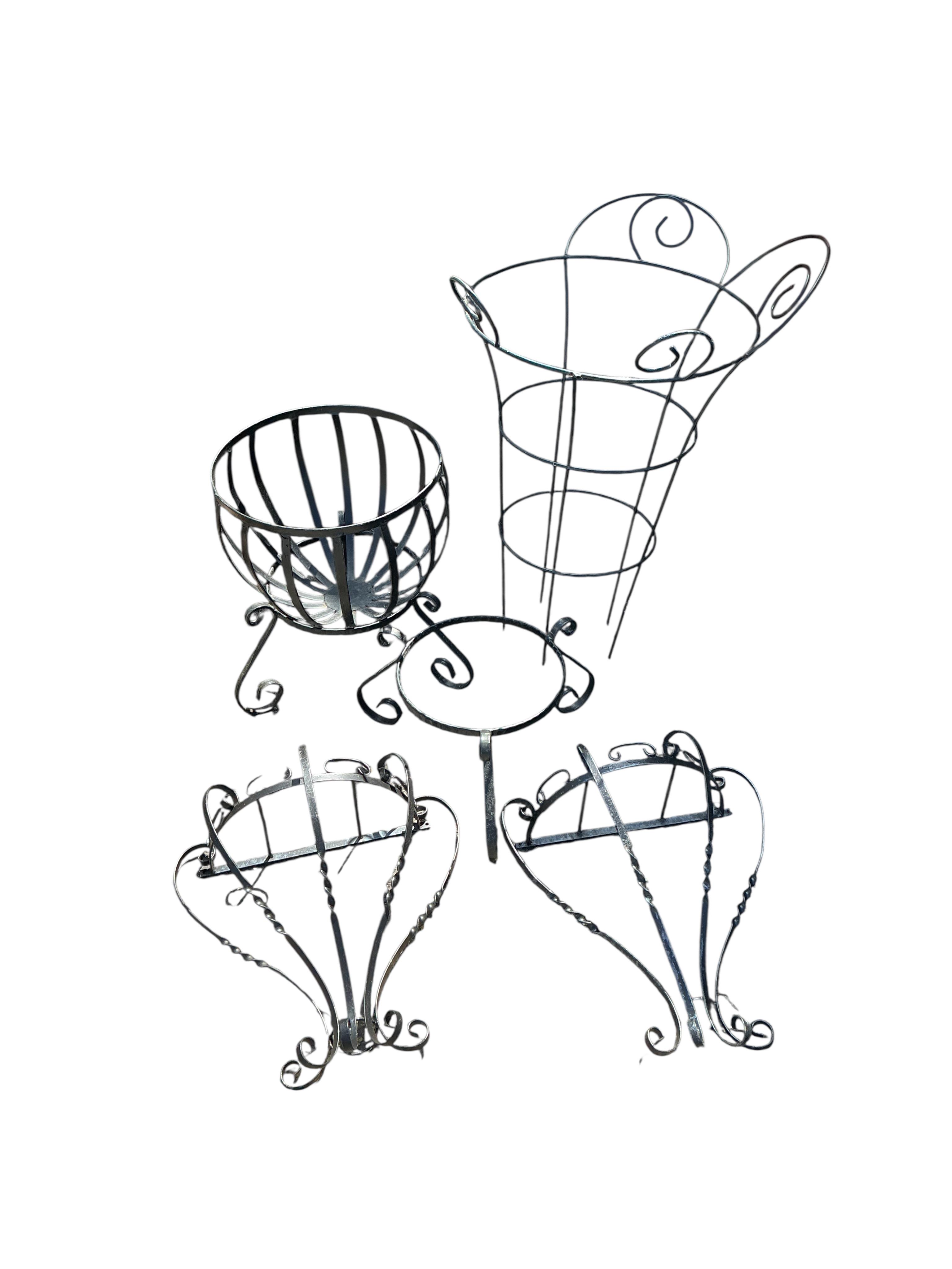 A wrought iron planter, growing frame and a pair of garden wall brackets